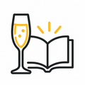 Ein Sektglas mit einem Buch im Hintergrund.